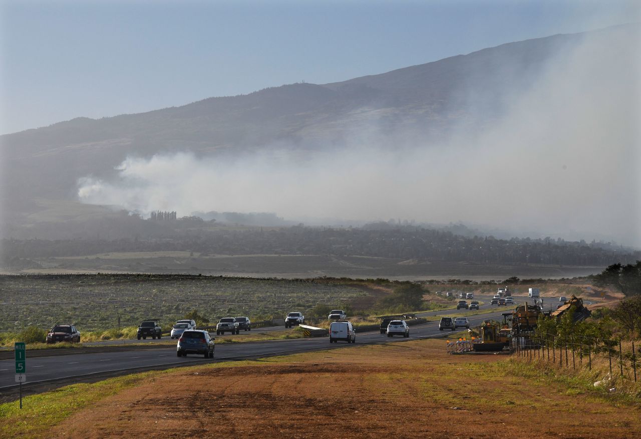 Smoke blows across the slope of Haleakala volcano on Maui, Hawaii, as a fire burns in Maui's upcountry region on Tuesday.