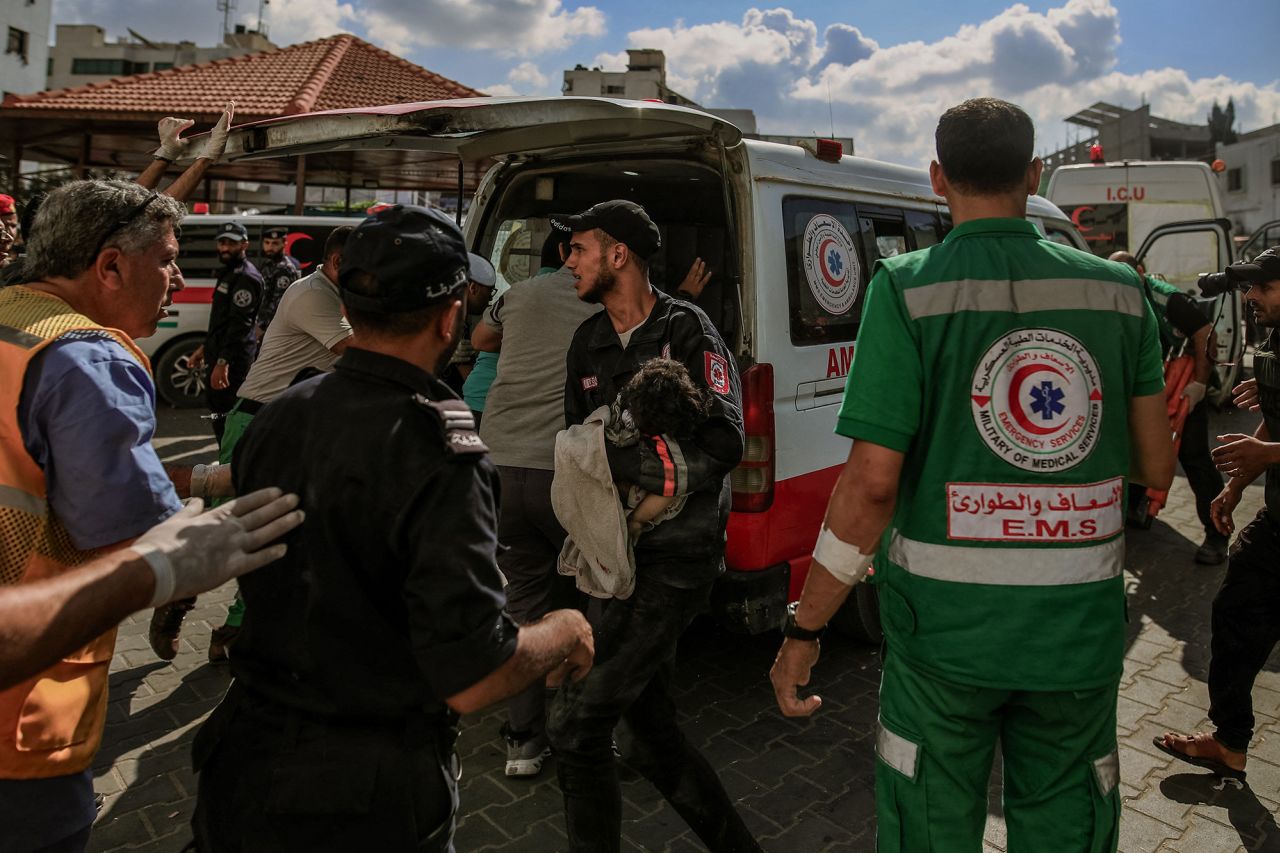 Injured individuals are transported to the overwhelmed Al-Shifa Hospital in Gaza City, Gaza, on October 18.