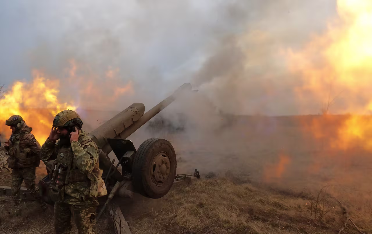 Ukrainian servicemen fire with a D-30 howitzer, near Bakhmut on Tuesday.