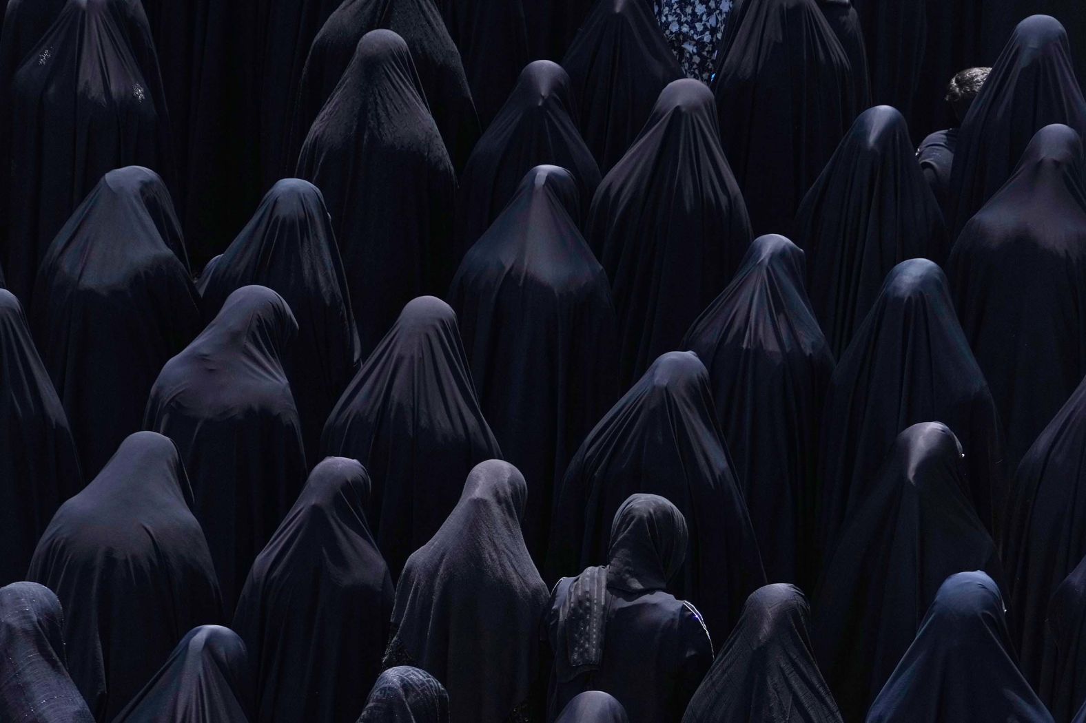 Shiite Muslim women pray at the shrine of Saint Abdulazim in Shahr-e-Ray, Iran, on Thursday, August 14, during a ceremony to observe Arbaeen, which marks the end of a 40-day mourning period that commemorates the seventh century death of Imam Hussein, the grandson of the Prophet Mohammed.