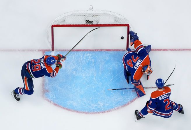 The puck slips past Edmonton Oilers goalie Stuart Skinner to end Game 2 of the NHL’s Stanley Cup Final on Friday, June 6. The game-winning goal, from the Florida Panthers’ Brad Marchand, came in double overtime and <a  target="_top" href="/newspapers?url=https://www.cnn.com/2025/06/07/sport/panthers-oilers-game-2-stanley-cup-final-spt">tied the series at one game apiece</a>.