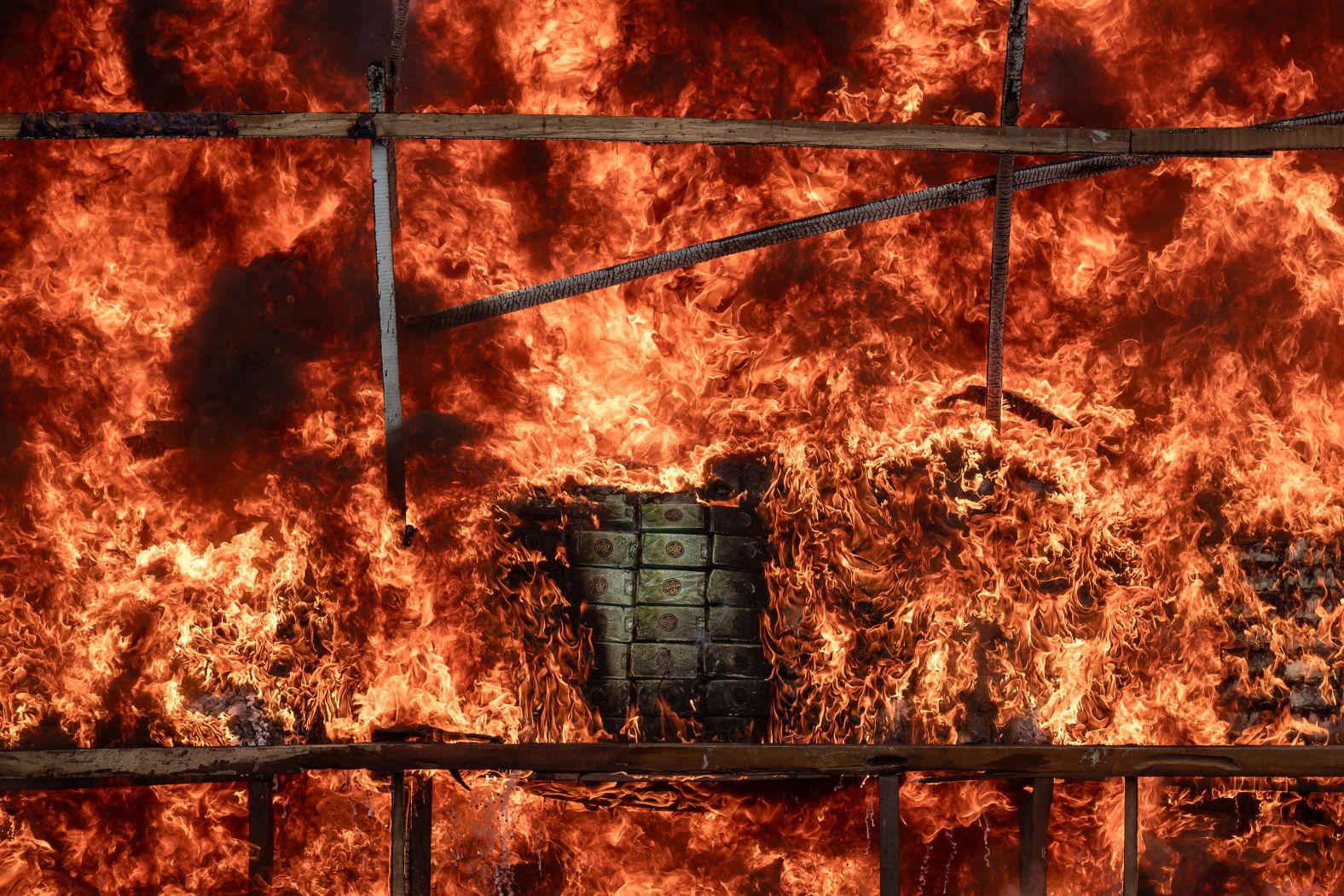 A pile of seized illegal drugs burns in Yangon, Myanmar, during a destruction ceremony marking the <a href="index.php?page=&url=https%3A%2F%2Fwww.un.org%2Fen%2Fobservances%2Fend-drug-abuse-day" target="_blank">International Day against Drug Abuse and Illicit Trafficking</a> on Thursday, June 26.
