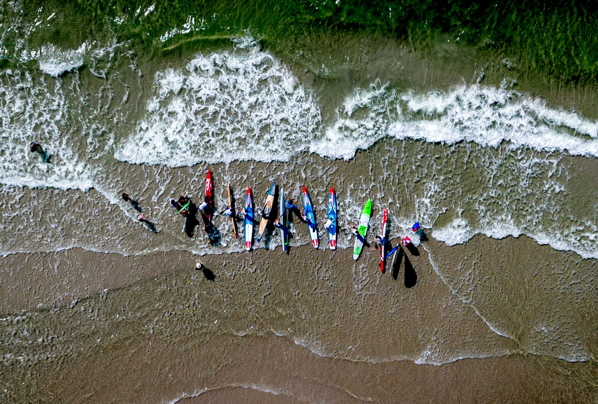 Competitors prepare for a stand-up paddle race on the German island of Fehmarn on Sunday, July 14.