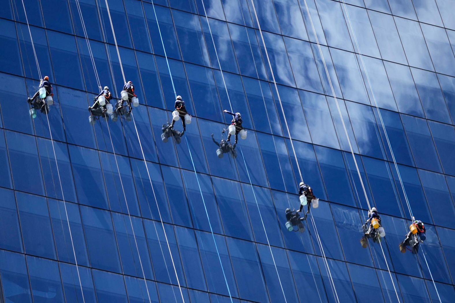 Window cleaners rappel from a skyscraper in Bogotá, Colombia, on Wednesday, October 15.