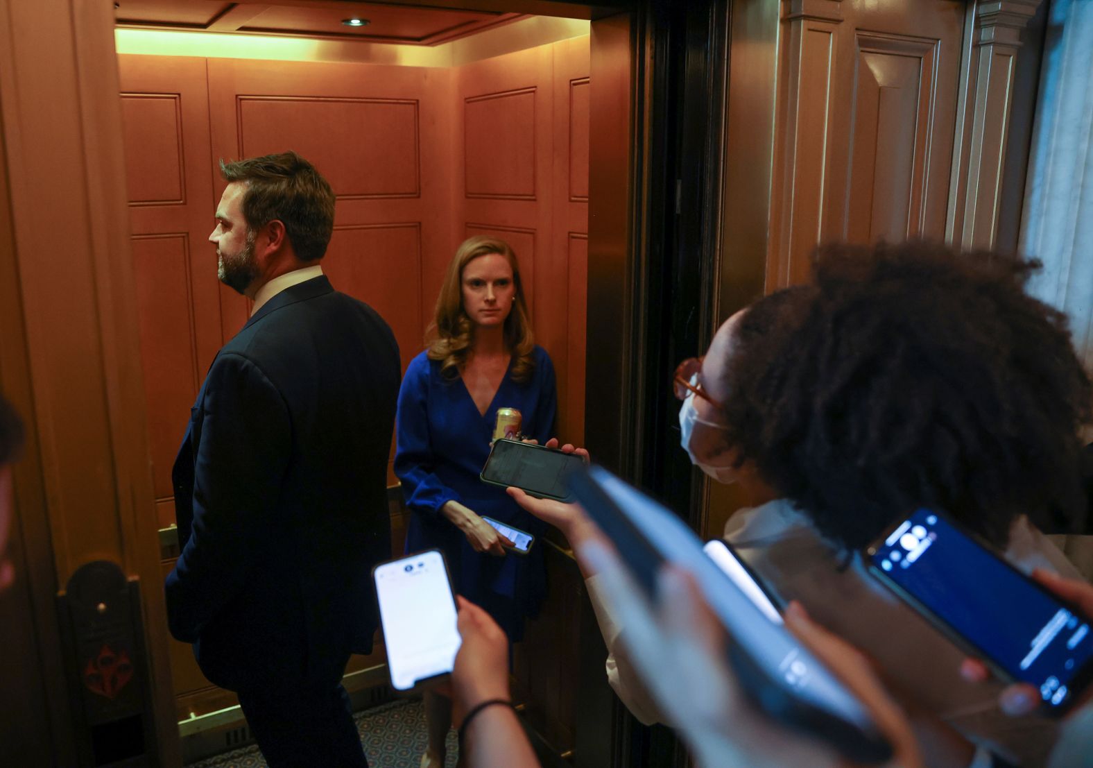 Vance, coming off a win in the Republican primary, is trailed by reporters as he boards a US Capitol elevator in May 2022. Vance had been invited to attend the Republican Senate Policy Luncheon.