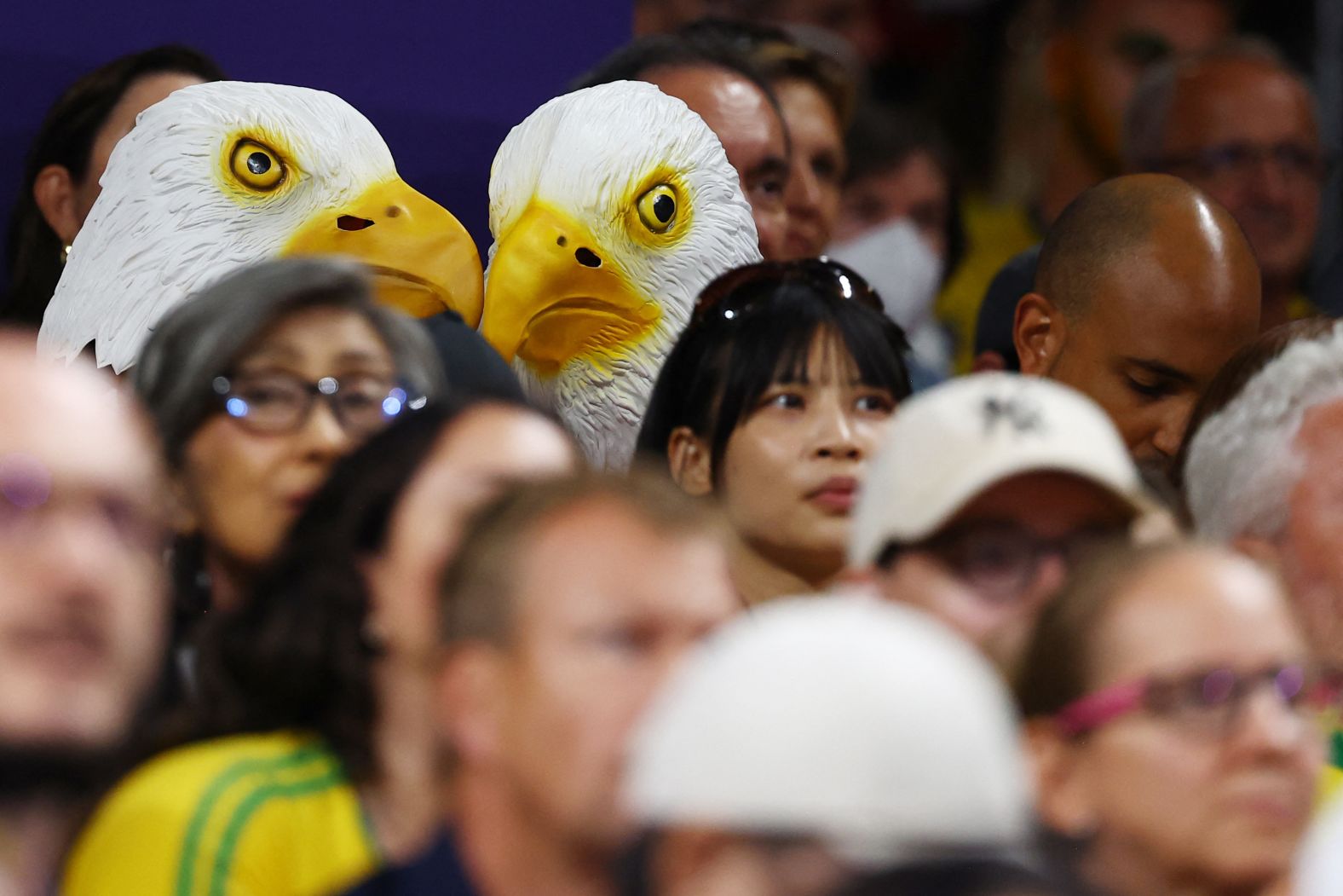 US fans wear bald eagle masks during a volleyball match on August 8.