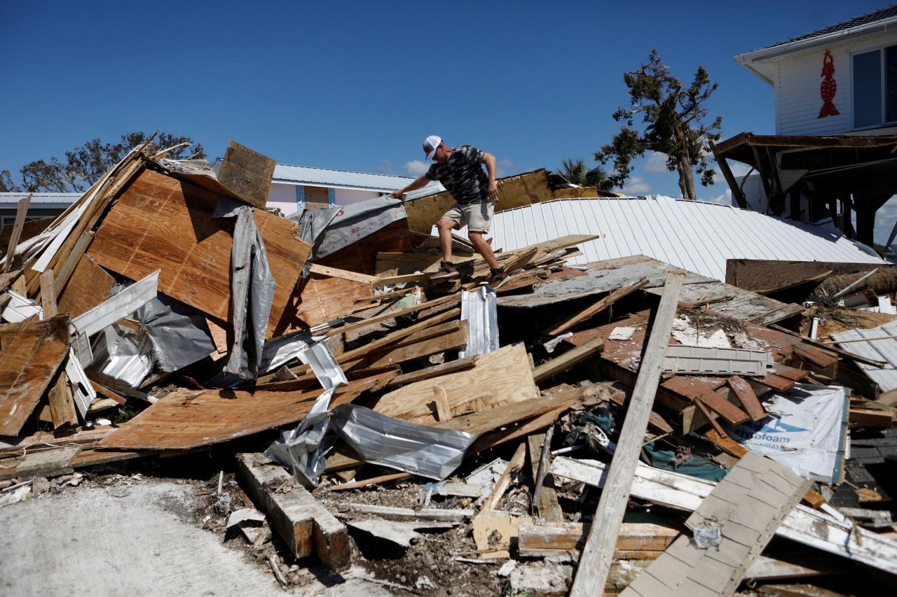 Baker Jarvis tries to recover belongings from his home in Keaton Beach, Florida, on Sunday.