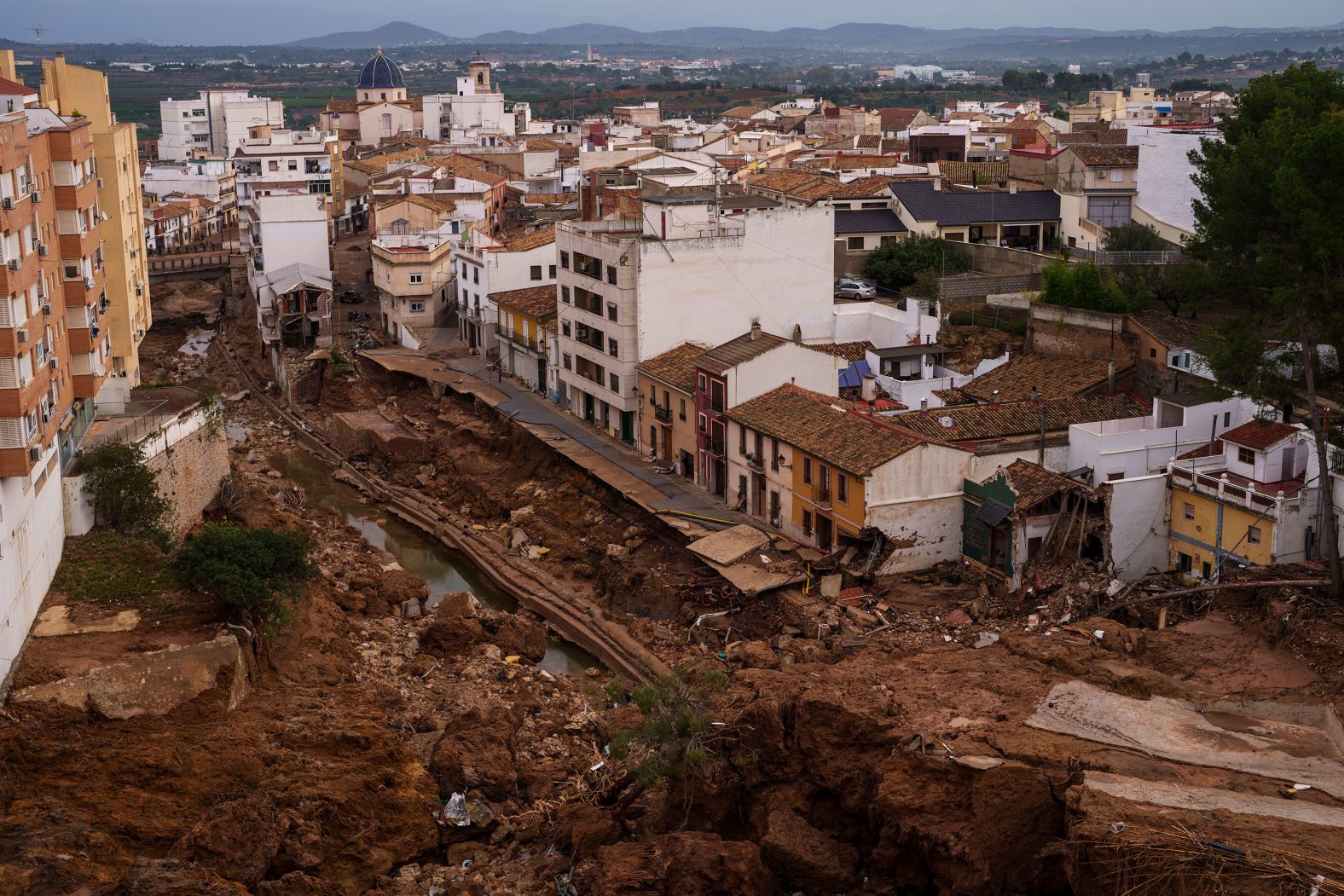 Destruction from the flooding is seen in Chiva on Friday.