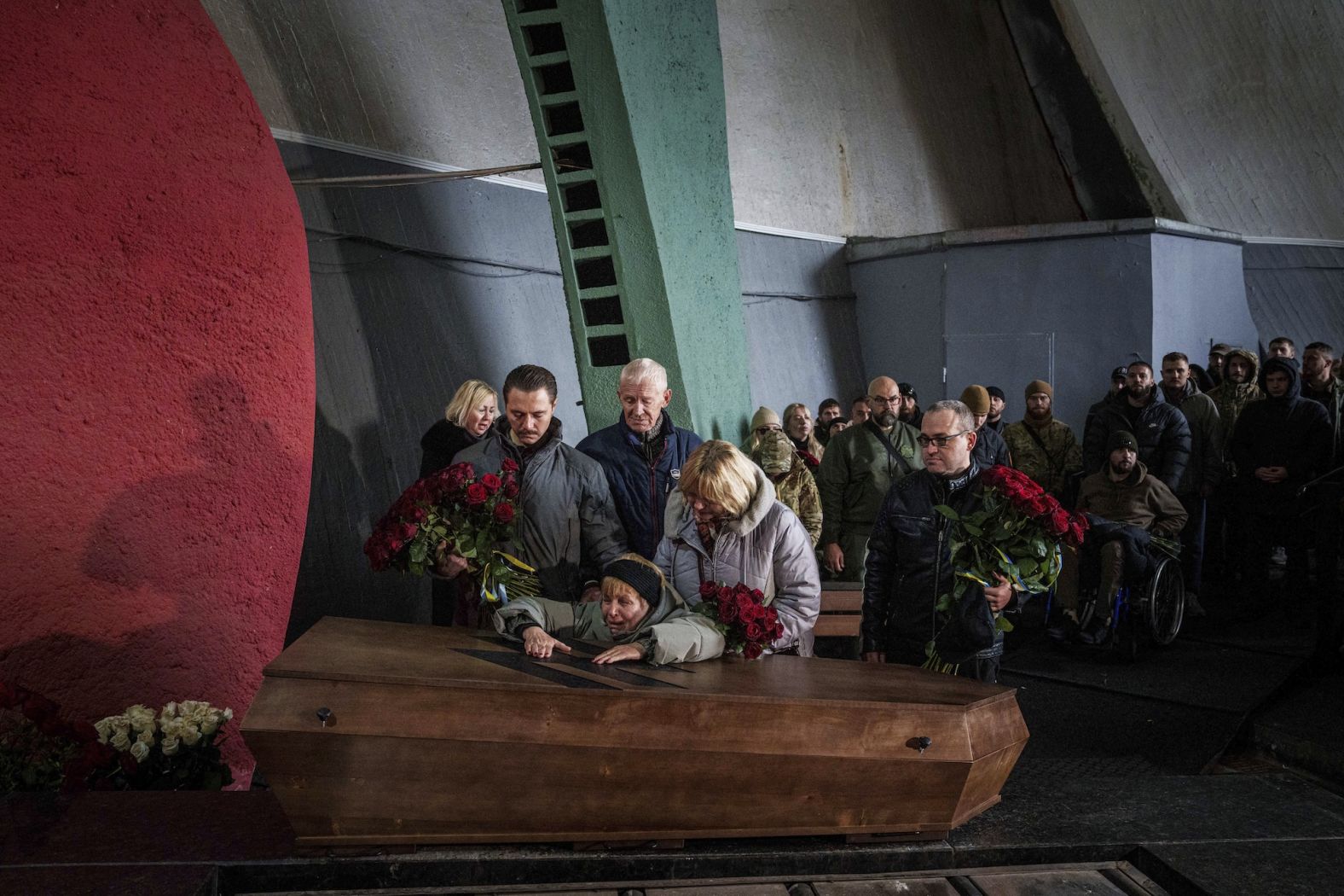 The mother of Valentyna Nahorna, a Ukrainian military medic, cries over her daughter’s coffin during her funeral in Kyiv, Ukraine, on Friday, November 8. <a href="index.php?page=&url=https%3A%2F%2Fapnews.com%2Farticle%2Frussia-ukraine-war-ed6d9e89978bba75b1bc487d9fa881db" target="_blank">Nahorna died in a Russian shell attack</a> along with Daniil Liashkevych, a soldier she fell in love with on the front line, according to the Associated Press.