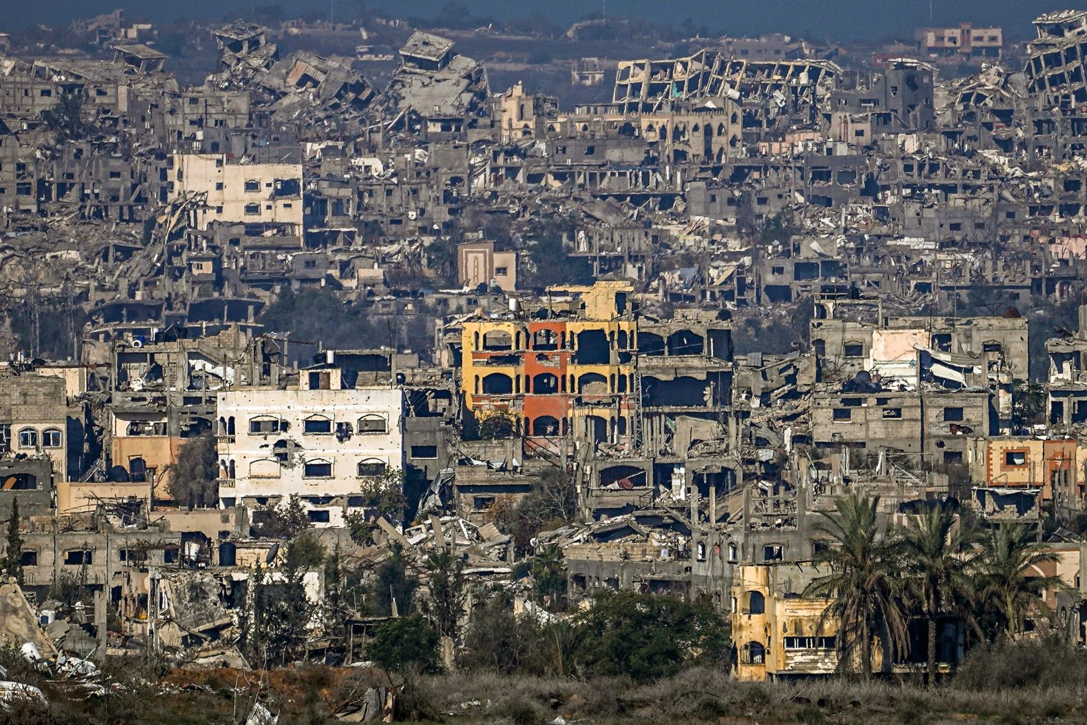 A destroyed part of Gaza City is seen from southern Israel on Thursday, January 2. The population in Gaza dropped by 6% in 2024, <a href="index.php?page=&url=https%3A%2F%2Fwww.cnn.com%2F2025%2F01%2F01%2Fmiddleeast%2Fisrael-population-migration-war-intl%2Findex.html">according to a new report</a>, as Israel’s war against Hamas took a heavy toll on the Palestinian enclave’s demographics. The Palestinian Central Bureau of Statistics said in a report released Tuesday that about 100,000 Palestinians have left Gaza since the beginning of the war on October 7, 2023, in addition to at least 45,553 who were killed in Israeli attacks in the strip, according to official figures by the Palestinian Ministry of Health.