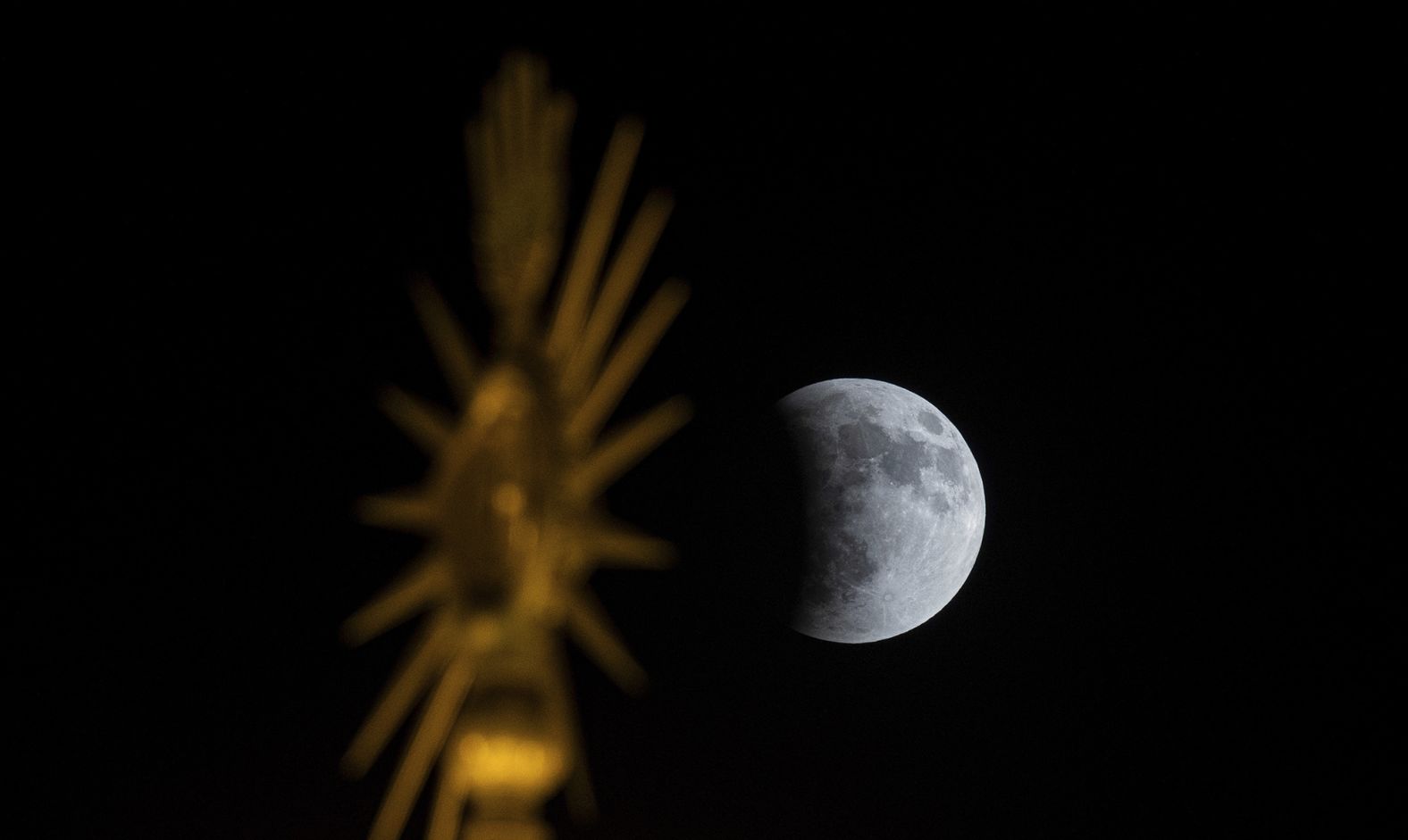 A partial lunar eclipse is seen in Najaf, Iraq.