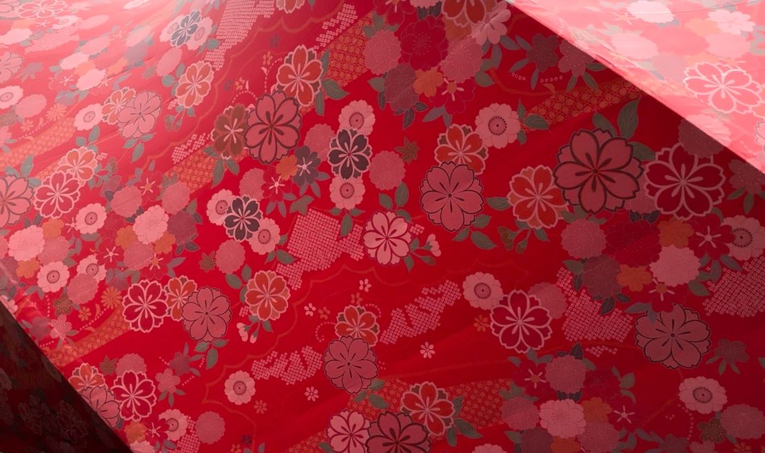 The brocade features a cherry blossom pattern.