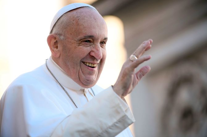 The Pope waves to people in St. Peter's Square in November 2018.