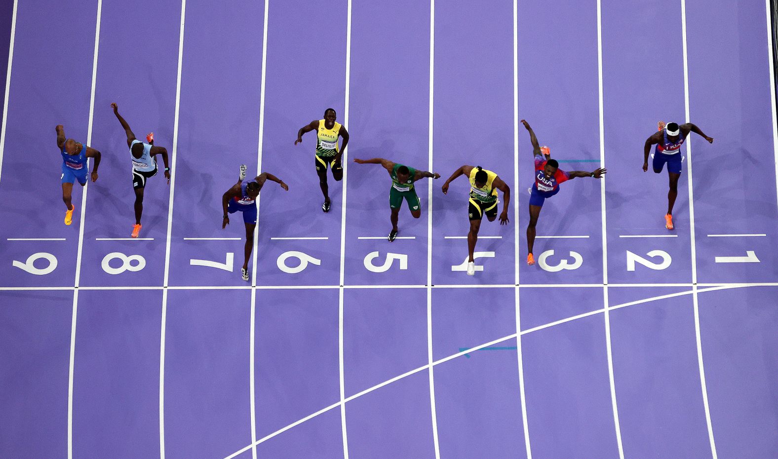 Olympic sprinters reach for the finish line during the men’s 100 meters on Sunday, August 4. American Noah Lyles, in Lane 7, won the <a href="index.php?page=&url=https%3A%2F%2Fwww.cnn.com%2F2024%2F08%2F04%2Fsport%2Fnoah-lyles-100-meter-gold-medal-spt%2Findex.html">incredibly close race</a>.
