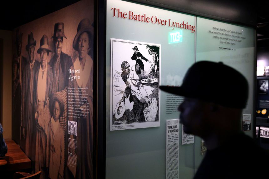 A visitor browses an exhibition about 