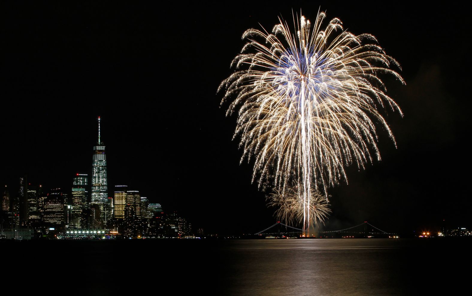 Fireworks celebrating the play's opening night explode over New York.