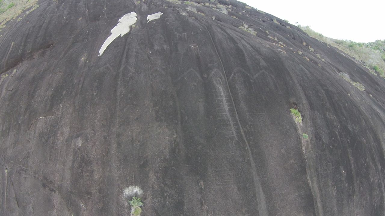 The rock art at Cerro Pintado, about 42 meters long, includes a giant snake, a human figure, a mask motif and a multilegged creature.