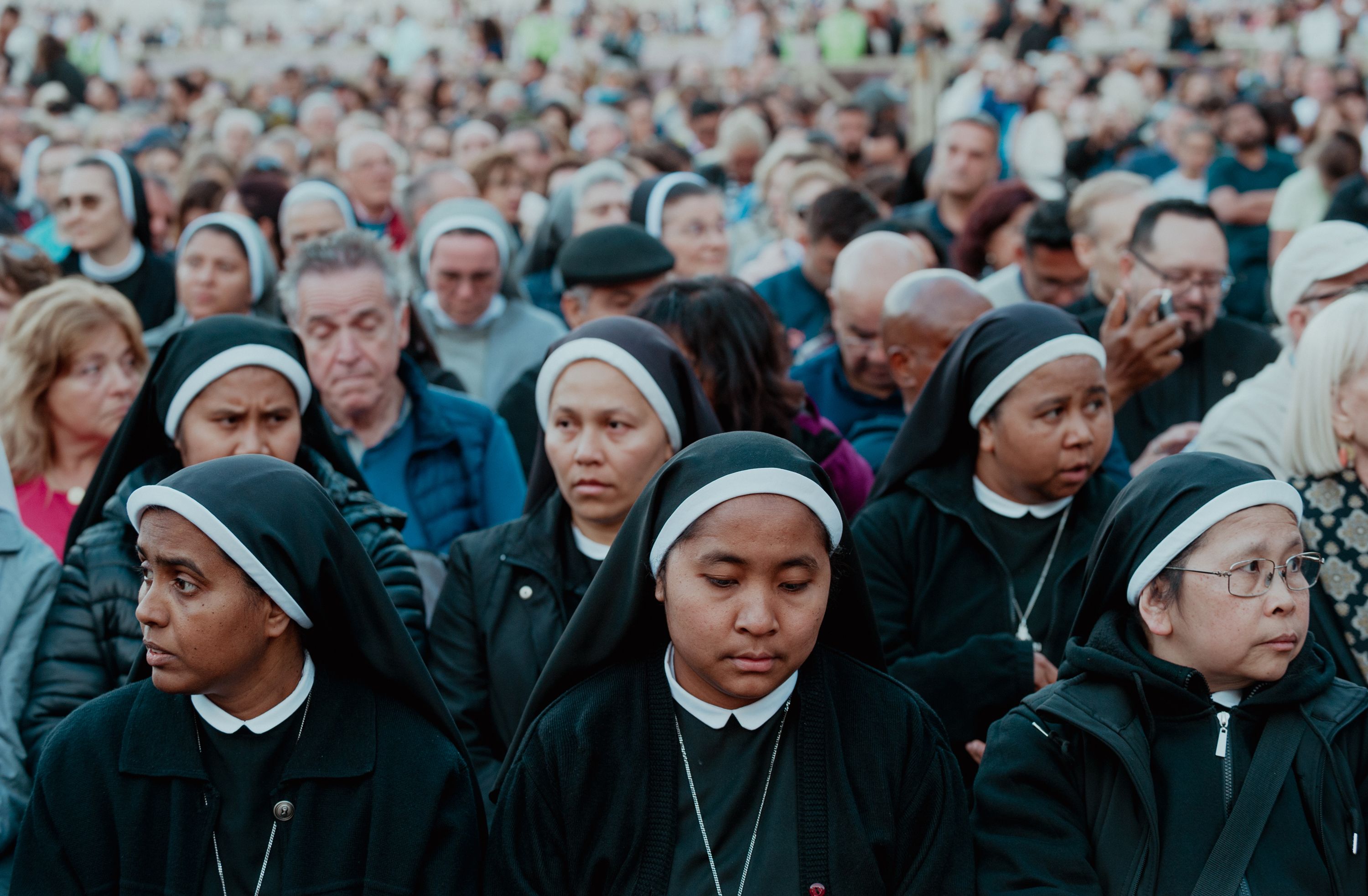 People gather Tuesday in St. Peter's Square.
