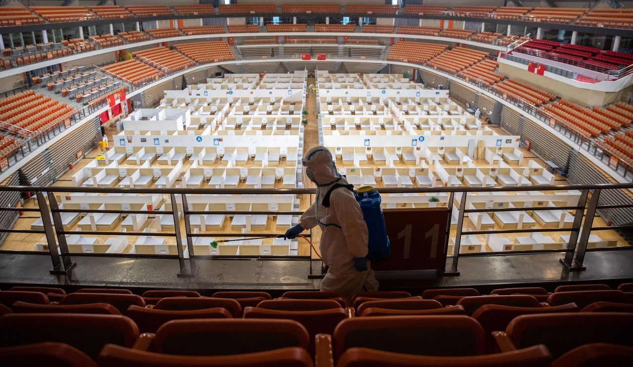 A staff member sprays disinfectant after the final patients were discharged from a temporary hospital set up to treat coronavirus in Wuhan, China on March 8. 