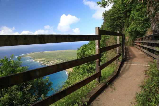 <strong>Isolated peninsula: </strong>A bridge on the Kalaupapa Pali Trail provides sweeping views of the beautiful peninsula and blue Pacific waters.