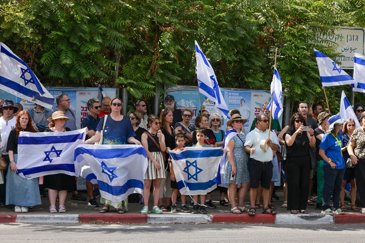 Israelis pay their respects near the family home of killed US-Israeli hostage Hersh Goldberg-Polin, whose body was recovered with five other hostages in Gaza, ahead of his funeral in Jerusalem on September 2.