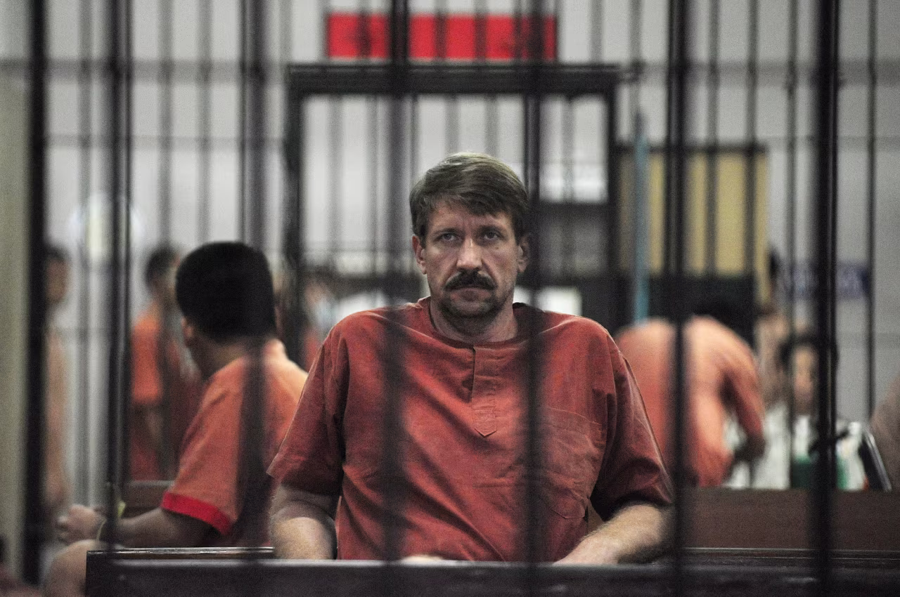 Alleged Russian arms dealer Viktor Bout sits in a temporary cell ahead of a hearing at the Criminal Court in Bangkok, Thailand, on August 20, 2010.