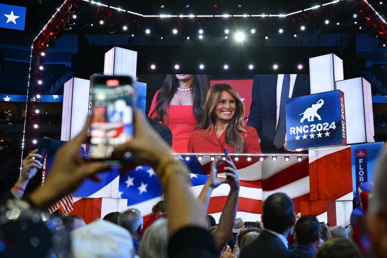 People hold up their phones as Melania Trump arrives at the convention on Thursday, July 18, in Milwaukee.