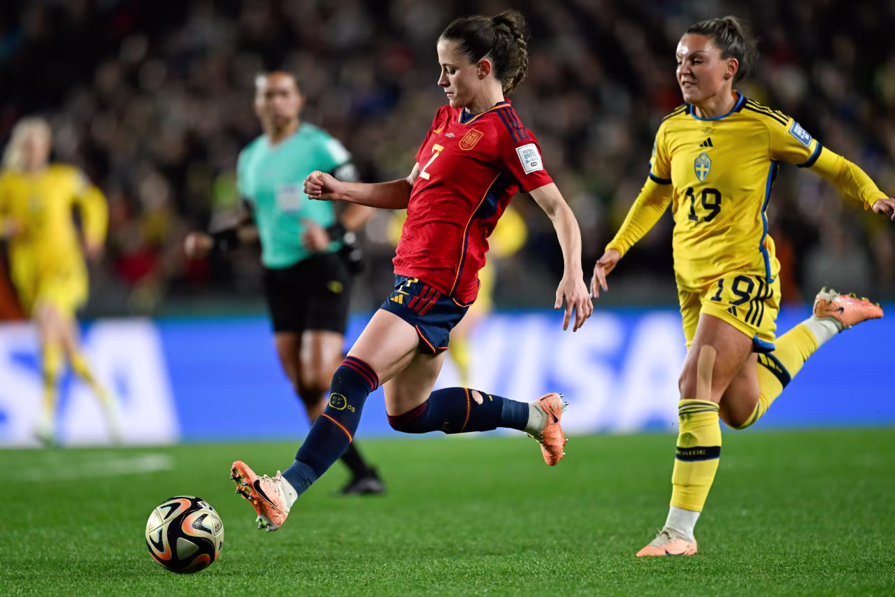 Spain's Ona Batlle, left, runs clear of Sweden's Johanna Kaneryd.