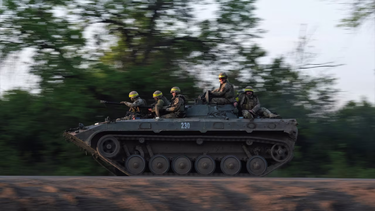 Ukrainian soldiers ride on a BMP infantry fighting vehicle toward Bakhmut, on May 20, 2023, amid the Russian invasion of Ukraine.