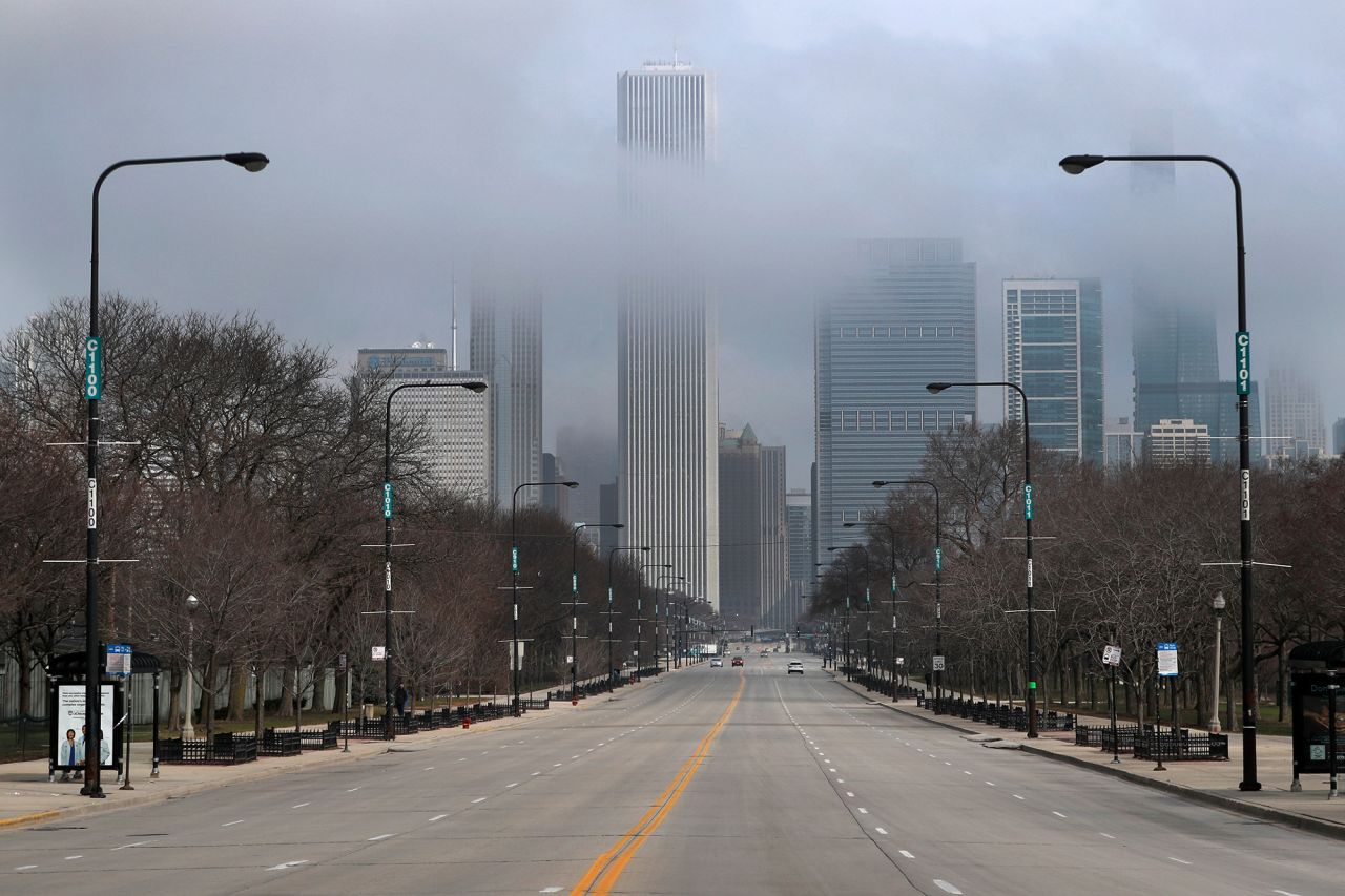 Fog lifts over Chicago and the usually busy Columbus Drive, Tuesday, March 24, on the second work day since Illinois Gov. J.B. Pritzker gave a shelter in place order last week due to the coronavirus.