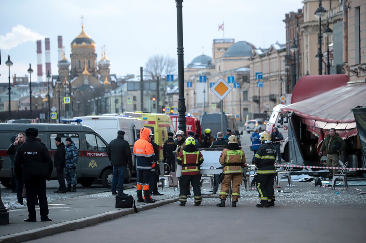 Members of the Ministry of the Russian Federation stand at the side of an explosion at a cafe in St. Petersburg, Russia on April 2.