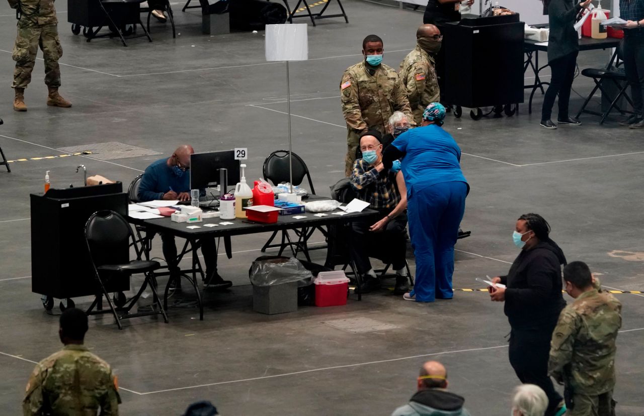 People are vaccinated at the Jacob K. Javits Convention Center on January 13 in New York City. 