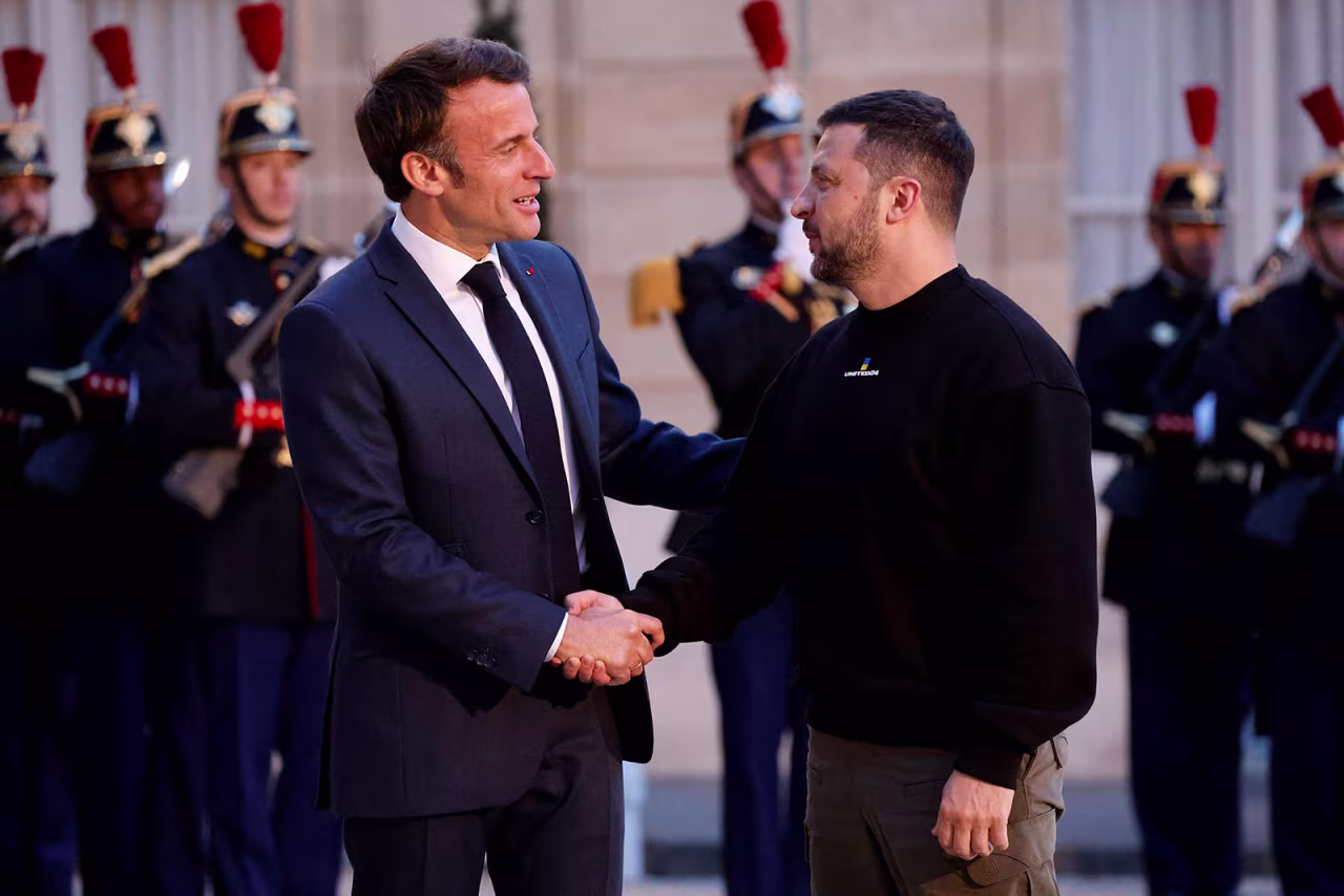 France's President Emmanuel Macron welcomes Ukraine's President Volodymyr Zelensky at the Elysee presidential palace in Paris on Sunday, May 14.