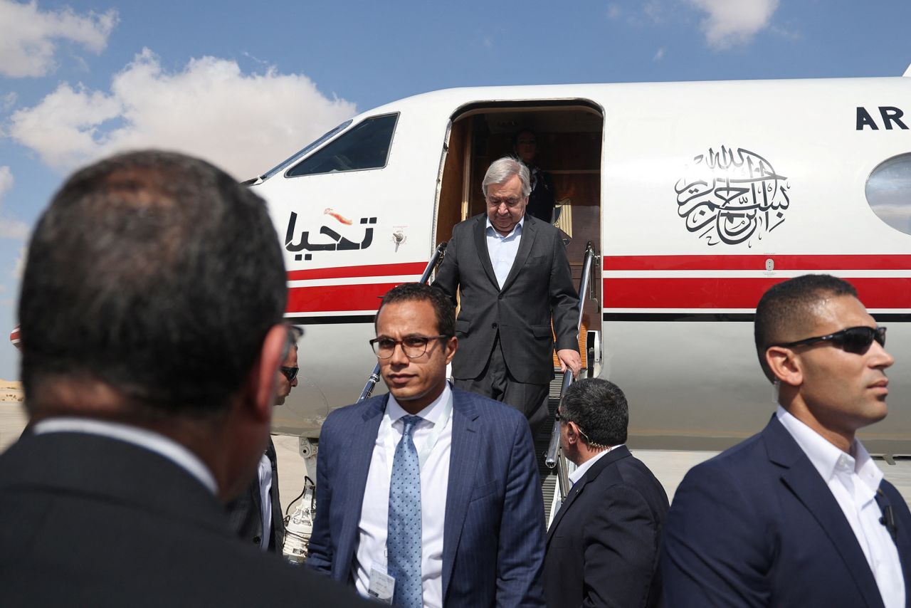 United Nations Secretary-General Antonio Guterres, center, arrives at Al Arish airport, Egypt, on October 20.