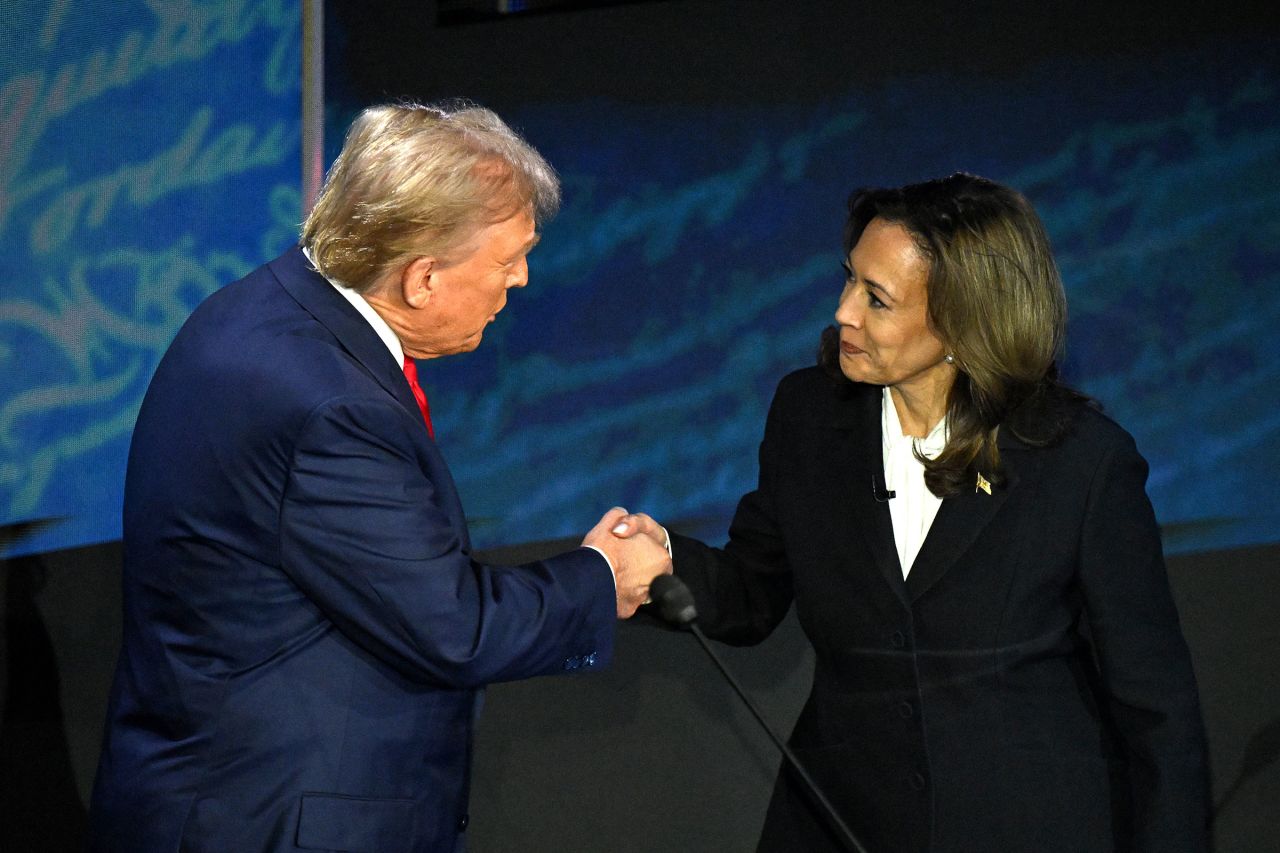 Former President Donald Trump and Vice President Kamala Harris shake hands ahead of their presidential debate Tuesday at the National Constitution Center in Philadelphia. Harris walked over to Trump and extended her hand. He accepted the handshake. 