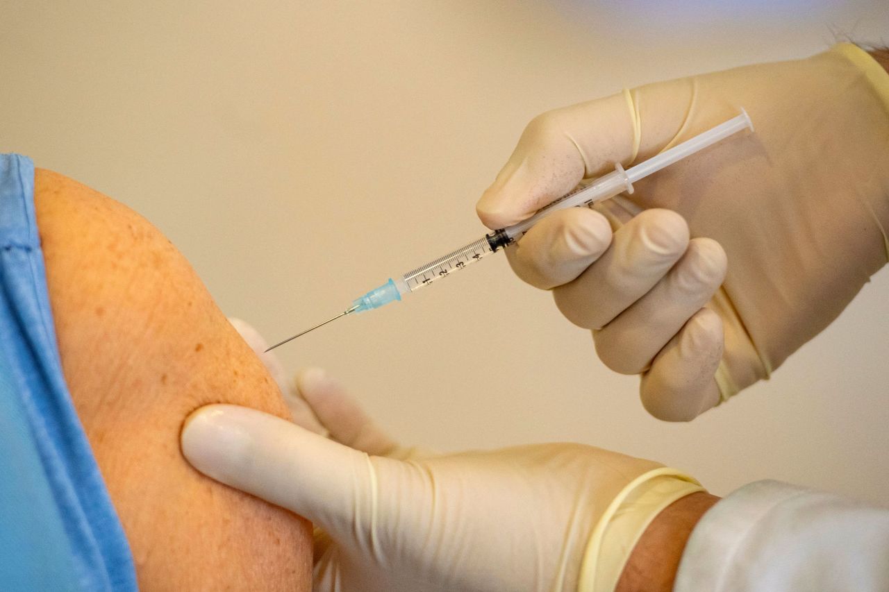 A general practitioner administers to a patient the AstraZeneca Covid-19 vaccine in Deisenhofen, Germany, on March 31.