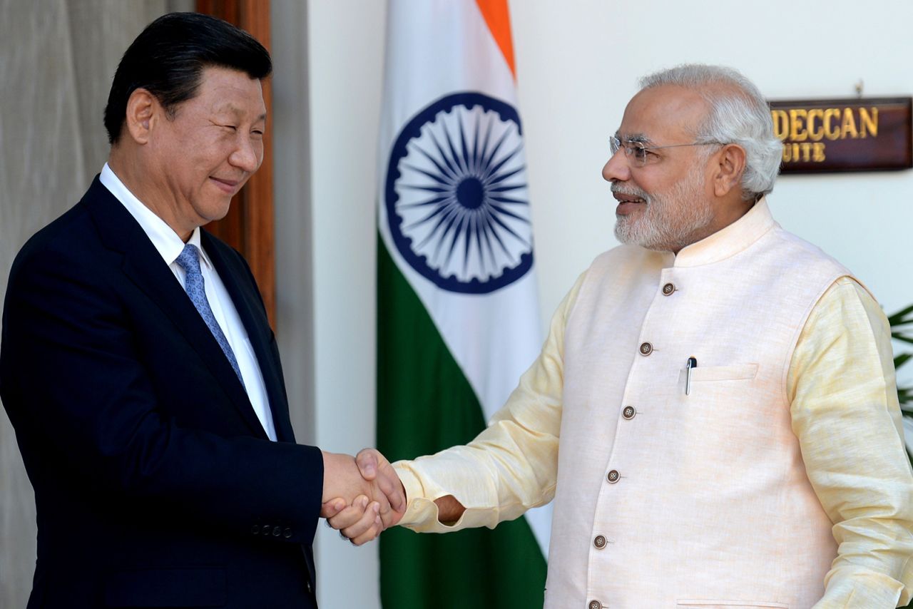 Indian Prime Minister Narendra Modi shakes hands with Chinese President Xi Jinping during a meeting in New Delhi on September 18, 2014.