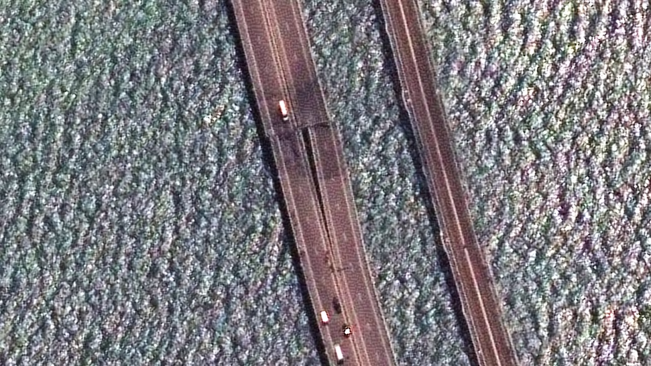 A satellite image provided by Maxar Technologies shows damaged parts of the bridge connecting the Russian mainland and the Crimean peninsula over the Kerch Strait on Monday, July 17.