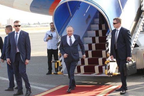 Russian President Vladimir Putin leaves his presidential plane during the welcoming ceremony at the airport, on July 19, in Tehran, Iran. 