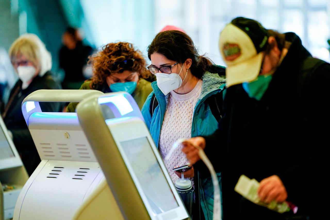 Travelers check in at the Philadelphia International Airport on Tuesday.