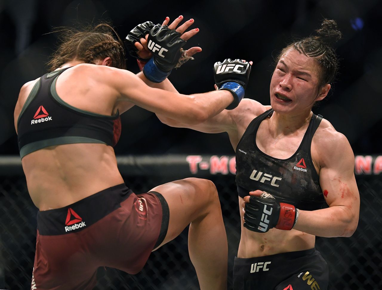 Weili Zhang punches Joanna Jedrzejczyk in her split decision win during a strawweight title bout at T-Mobile Arena on March 7, in Las Vegas, Nevada.