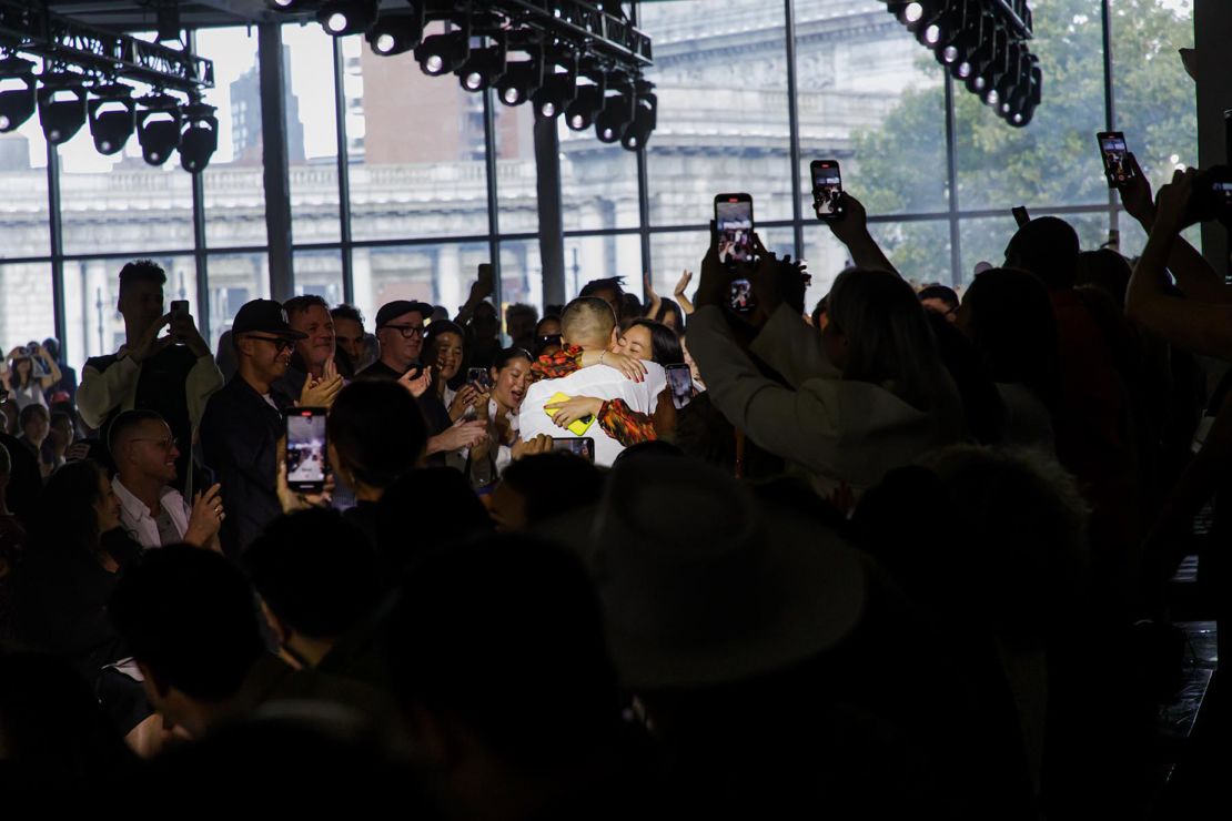 Lim and Zhou embrace at the conclusion of 3.1 Phillip Lim's Spring-Summer 2024 runway show, to cheers and applause from the audience.