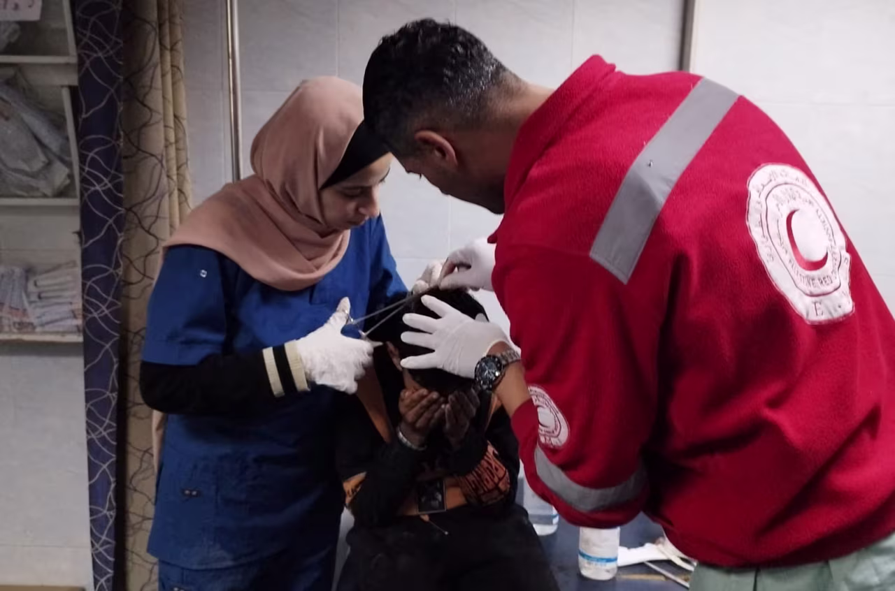 An injured Palestinian boy receives medical assistance at Al-Amal Hospital in Khan Younis, Gaza, in this handout image released on January 23. 