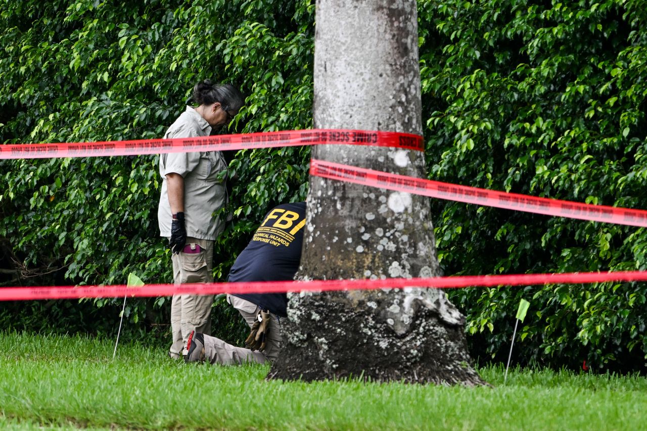 Members of FBI are seen at the crime scene outside the Trump International Golf Club in West Palm Beach, Florida, on September 17.