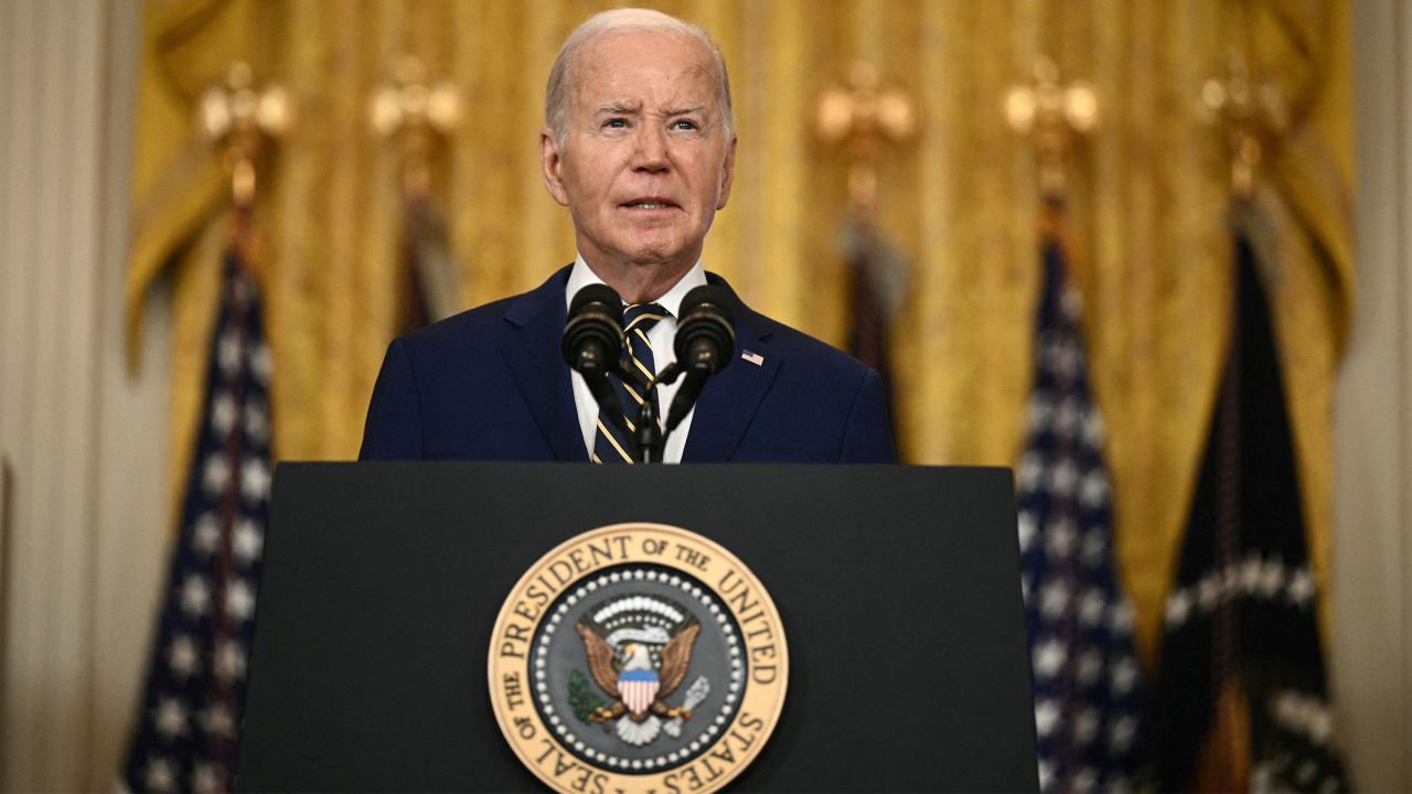 President Joe Biden speaks in the East Room of the White House in Washington, DC, on June 4, to announce he will temporarily shut the US-Mexico border to asylum seekers whenever illegal migrant crossings surge.