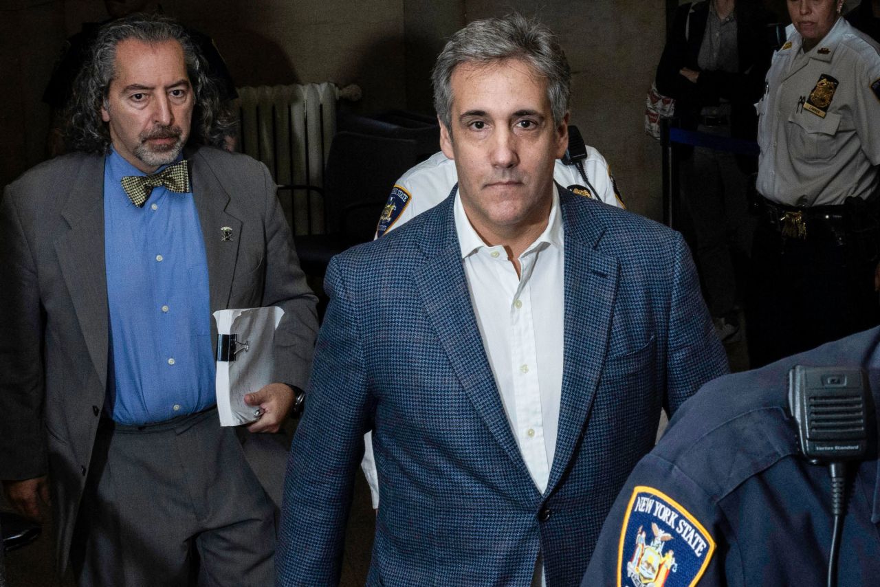 Michael Cohen, center, is seen in New York in October.