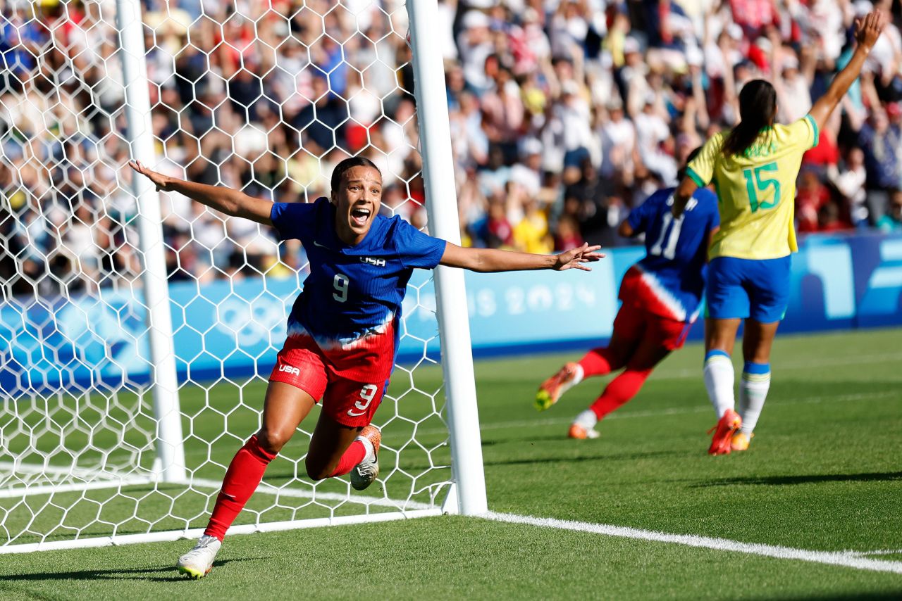 Mallory Swanson of the United States celebrates after scoring the opening goal on Saturday, August 10. 