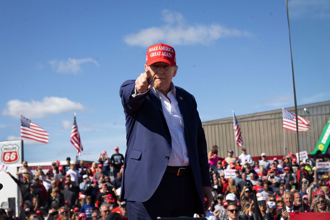 Former President Donald Trump gestures during a campaign event at the Central Wisconsin Airport in Mosinee, Wisconsin, on September 7.