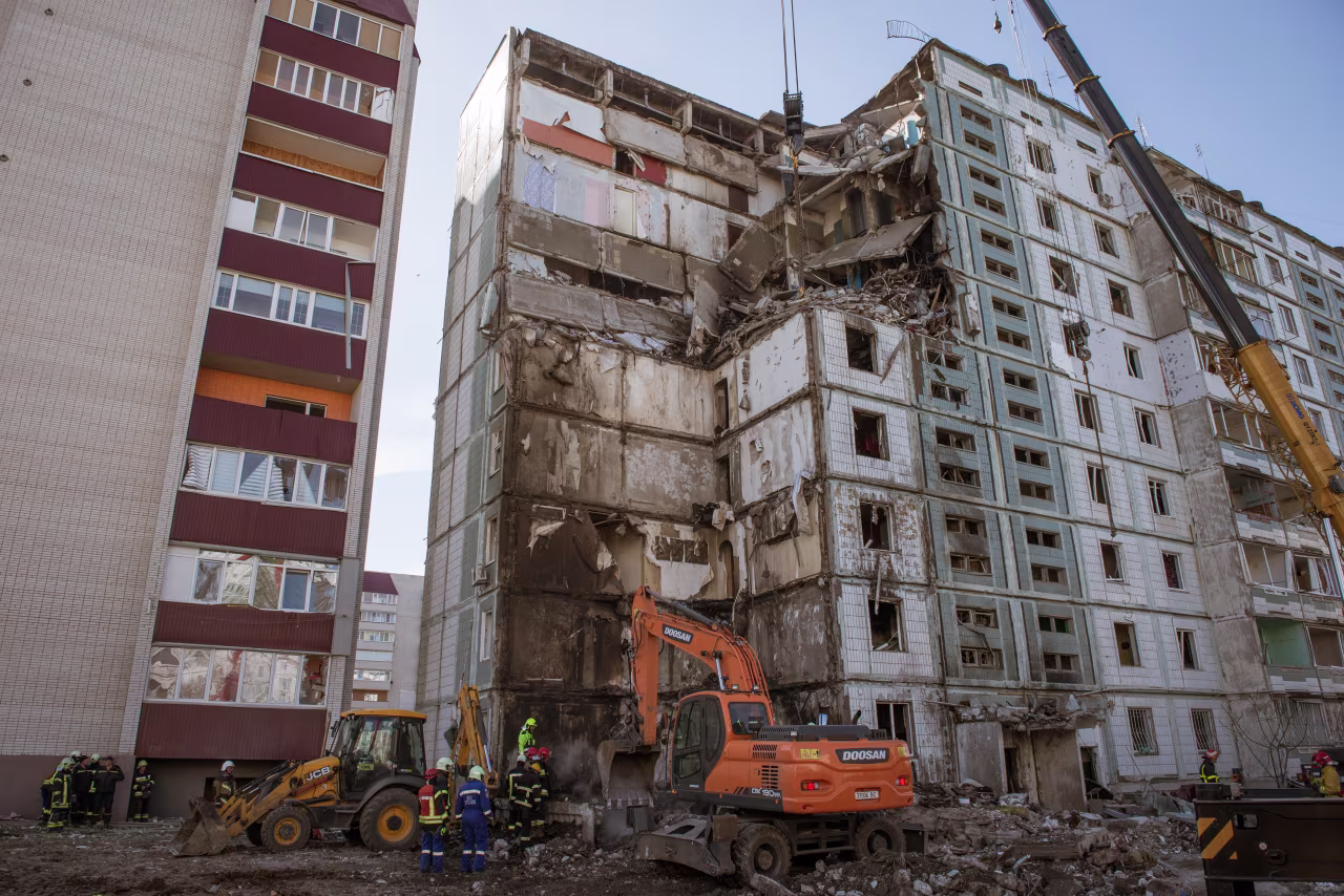 Firefighters and search and rescue teams conduct operation after Russian rocket hit residential building in Uman district located in Cherkasy Oblast, Ukraine, on April 28