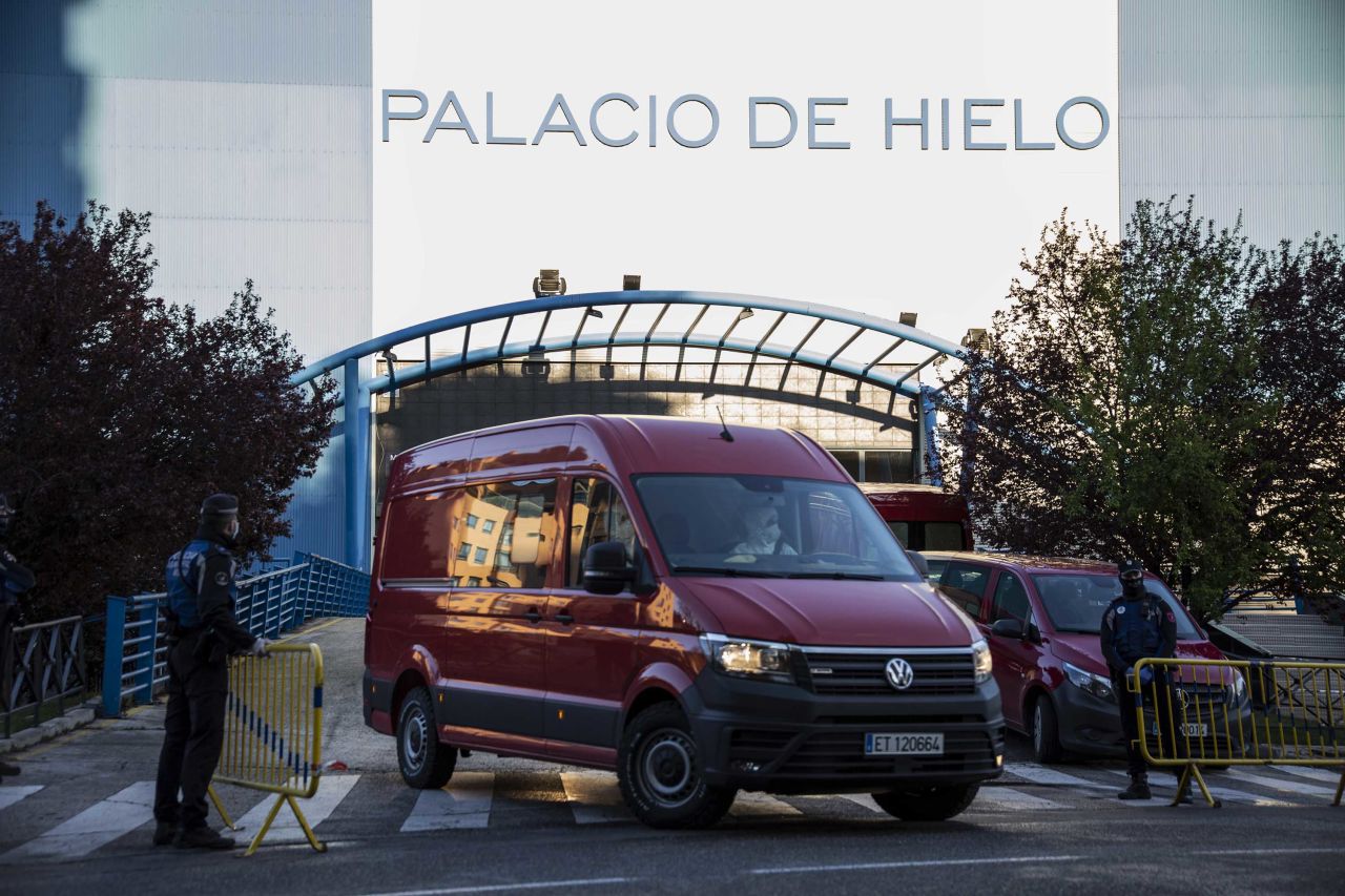 Members of Spain's Military Emergency Unit (UME) work on March 23 at the Palacio de Hielo mall in Madrid, where an ice rink will be used as a morgue for coronavirus victims, d